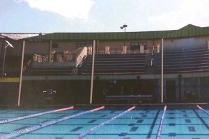 A structure will be built above the bleachers, providing shade for swimming and water polo fans and a base for the solar panels. 